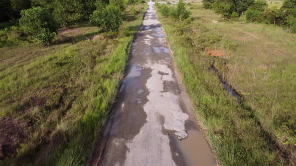 Aerial view broken asphalt road