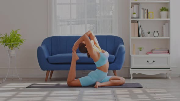 Side view of Asian woman doing Yoga exercise,Yoga One Legged King Pigeon