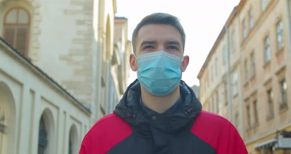 Young Student Man Wearing Protective Mask on street.Concept of Health and Safety Life, N1H1