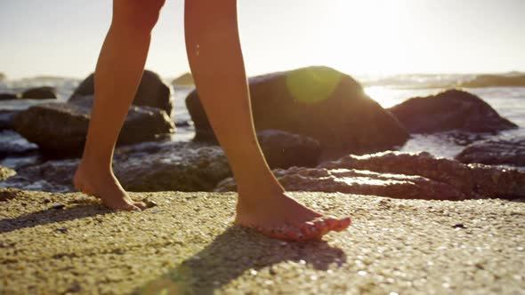 Woman walking on the beach 4k