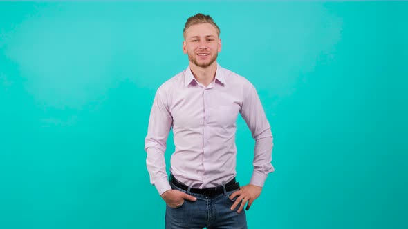 Portrait of Funny Handsome Man Showing Victory Symbol with Fingers .