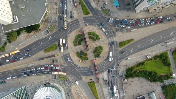 Cars on the roundabout in city center seen from a drone