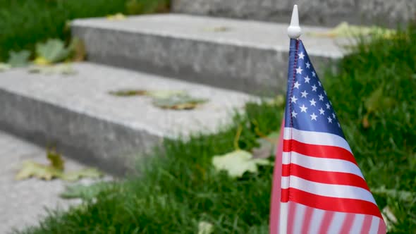 Unrecognizable Male Person Rises on Granite Steps on Memorial