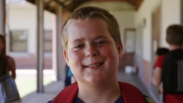 Boy smiling in the school corridor