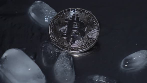 bitcoin on a black background in the rain