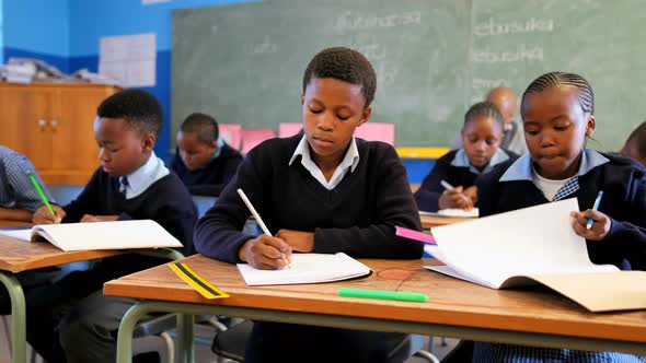 Schoolkids studying in the classroom 4k