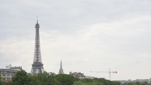 Construction of steel Eiffel tower by the day slow tilt 3840X2160 UHD footage - Tilting on famous Fr