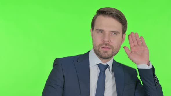 Young Businessman Listening Carefully, Silence Green Screen