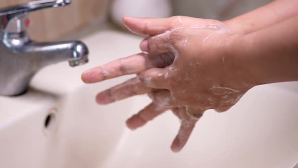  Women Washing Hands with Soap Warm Water 