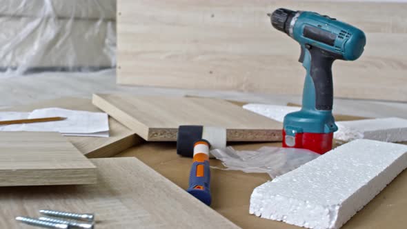 Tools and Pieces of Furniture Lying on Floor alt