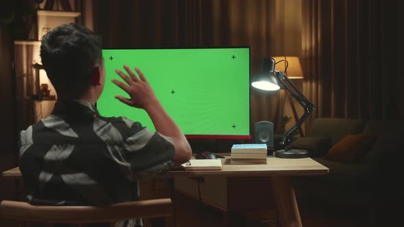 Asian Boy Learning Online, Raising Hand Distance At Virtual Lesson Class With Computer Green Screen