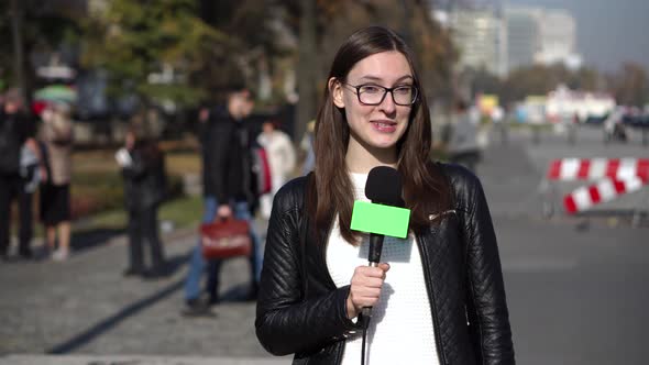 Girl Journalist Is Reporting on the Street