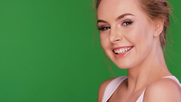 Cute Girl Laughing To the Camera Isolated on Green Chromakey