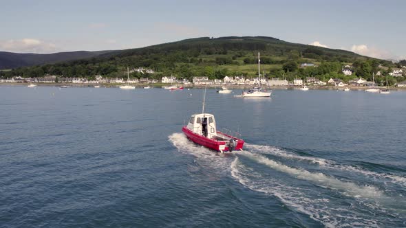 A Small Passenger Ferry Heading Towards an Island in the Summer