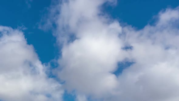 Time lapse of moving clouds in blue sky