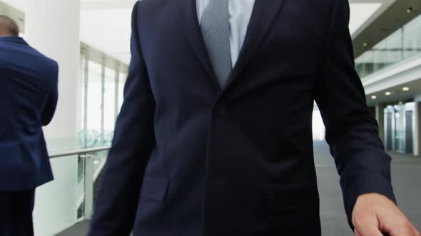 Businessman walking in a modern office building