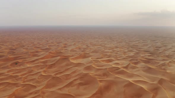 Aerial view of red Desert Safari with sand dune in Dubai City, United Arab Emirates or UAE