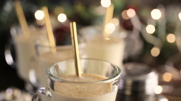 Traditional holiday drink egg nog garnished with nutmeg.