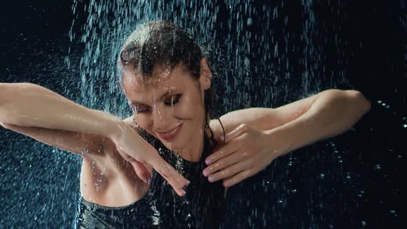 Female Dancer Showing Flexibility Dance Under Rain