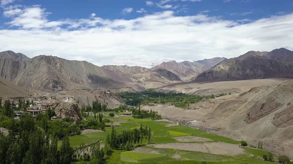 Stunning landscape in Ladakh India. Aerial view of lush farms and himalayan peaks