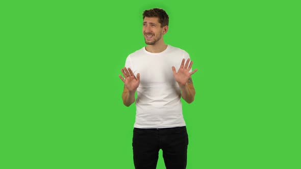 Confident Guy Is Relaxing and Meditating. Green Screen