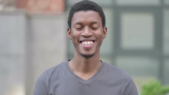 Portrait of Young Young African Man Saying Yes By Shaking Head