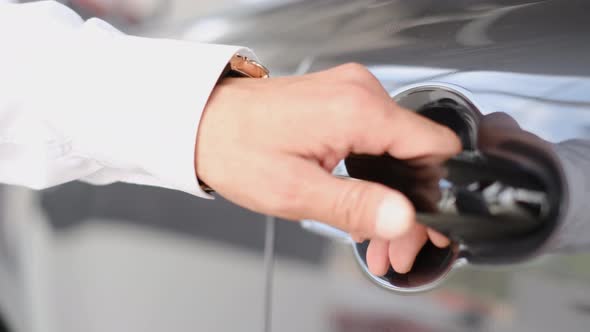 Male Businessman Opens the Driver's Seat Door