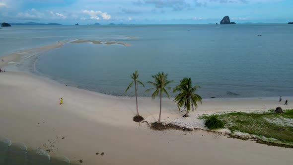 Couple Men and Women Walking on the Beach at the Island Koh Yao Yai Thailand Beach with White Sand