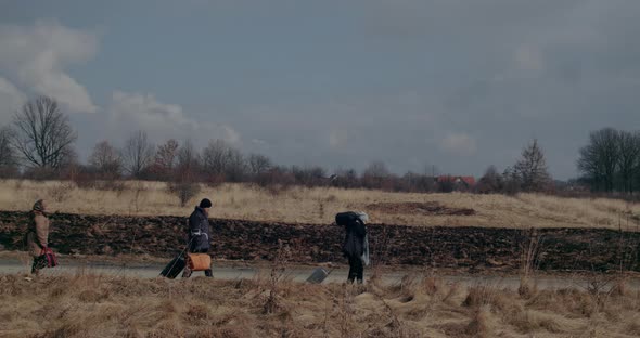 Immigrants Walking On Road During War Problems