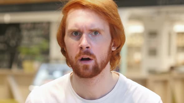 Redhead Beard Man Disliking and Rejecting Offer in Cafe