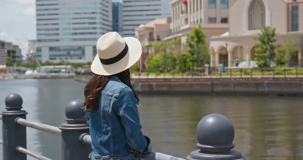 Woman look around the city view in yokohama