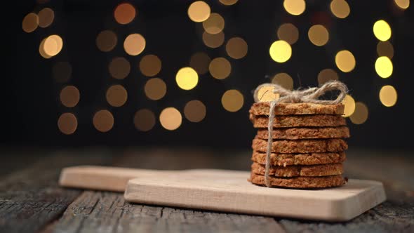 A Stack of Organic Oatmeal Cookies for Christmas with Glowing Bokeh Lights