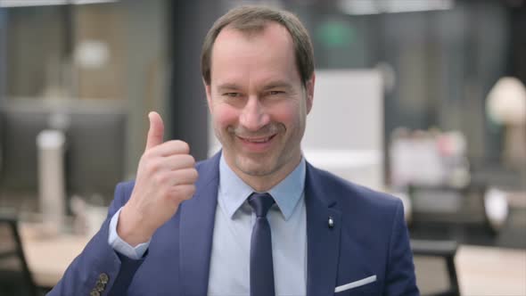 Portrait of Businessman Showing Thumbs Up Sign