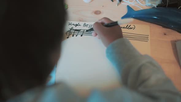 Child Writes In Music Christmas Song