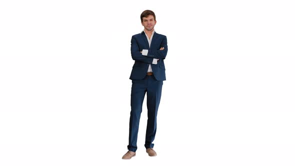 Handsome Young Businessman Standing Arms Crossed, Smiling Confidently on White Background.