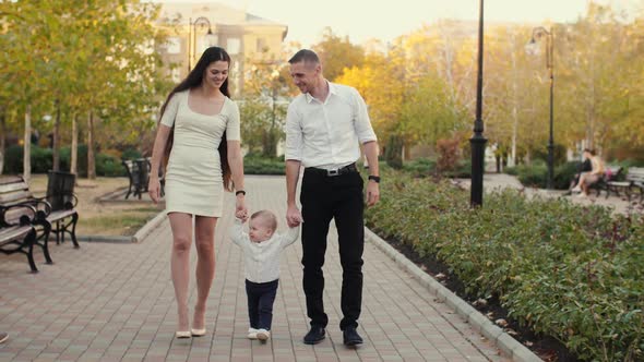 Happy Family Walking at Park