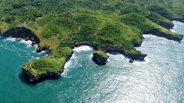 Tropical green promontory shoreline aerial view, Kesirat, Yogyakarta, Indonesia