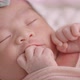 Close Up Lovely Newborn Baby Infant Sleeping On Bed. - VideoHive Item for Sale
