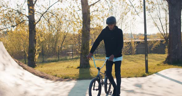 The Best Skater in Town Walks Into Park on Ramps Walks Through Middle of Square