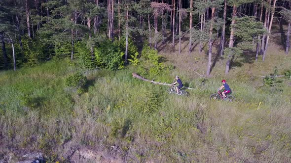 Men Riding Bicycle in Nature