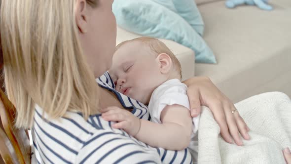 Mother with Sleeping Baby alt