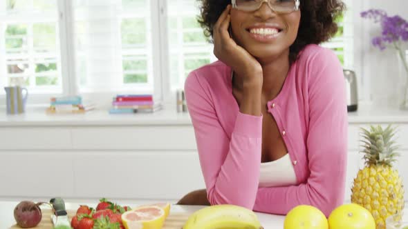 Smiling woman standing in kitchen