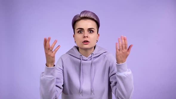 Young Woman Gesturing with Pretension Scolding Isolated Indoors