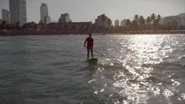 Aerial View From Above Athletic Young Women and Men Surf, Ride Big Waves with Bright Daylight