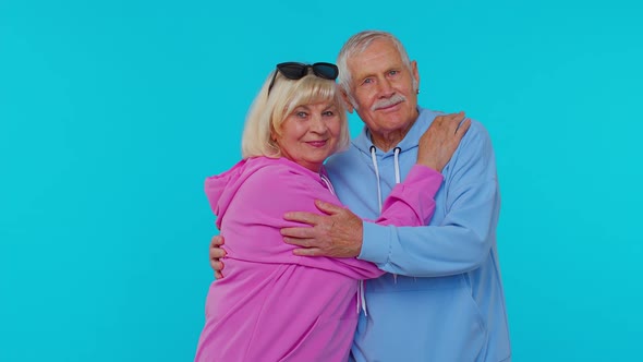 Cheerful Lovely Senior Couple Man Woman Grandparents Smiling Hugging Enjoying Lifestyle Together