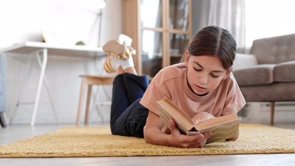 Girl Reading Book at Home