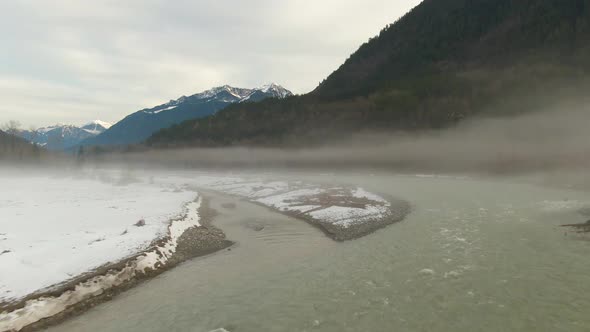 Aerial View of Chilliwack River with Snow During Winter Season