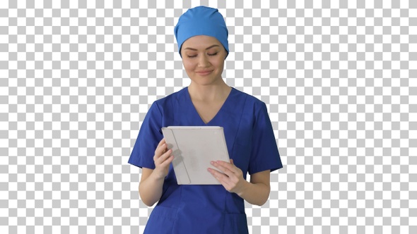 Smiling female nurse using tablet computer, Alpha Channel