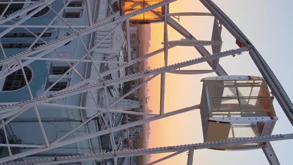 Vertical Video  Ferris Wheel in the Morning at Sunrise in Kyiv Ukraine