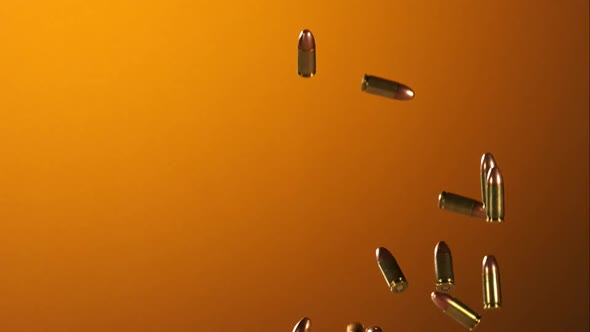 Bullets falling bouncing in ultra slow motion 1500fps on a reflective surface - BULLETS
